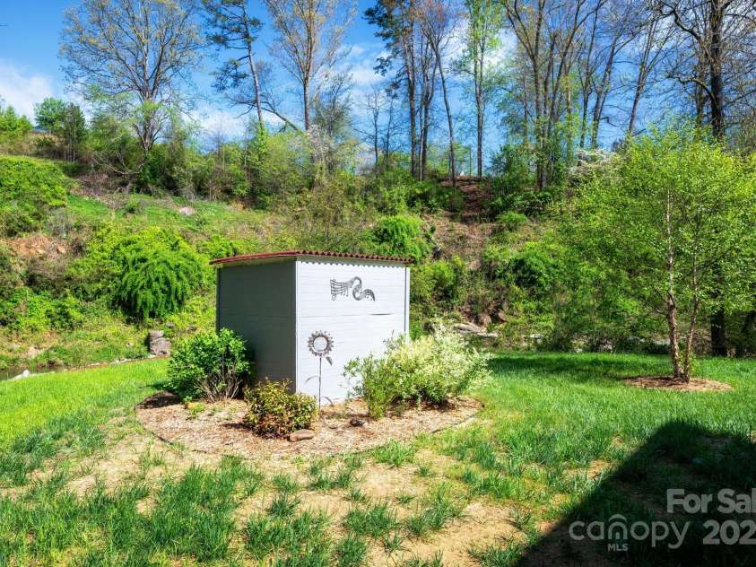 85 Laurel Cove Road, Candler, NC 28715.  MLS# CAR4251695, YatesRealty ID 10564. Well House with Filtration System
