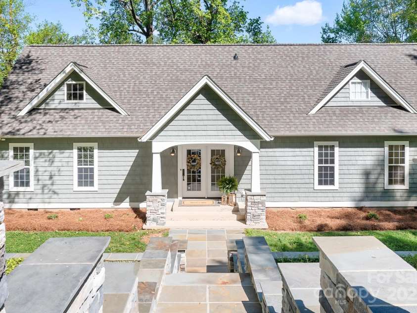 234 Winding Shore Road, Troutman, NC 28166.  MLS# CAR4245762, YatesRealty ID 10588. A recently built, stone walkway leads you to a welcoming front entry.