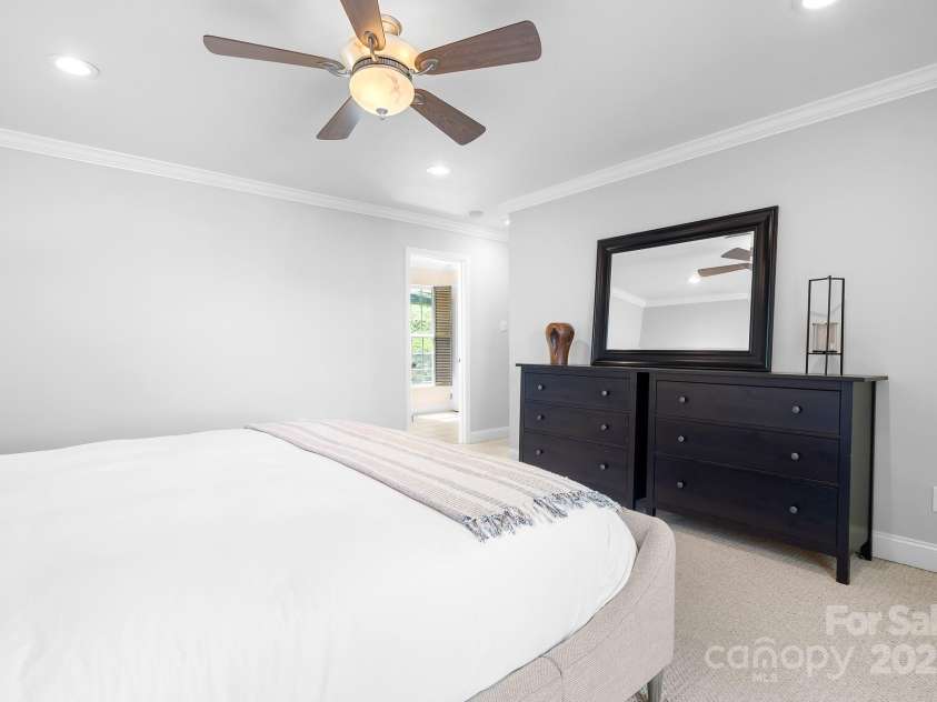 234 Winding Shore Road, Troutman, NC 28166.  MLS# CAR4245762, YatesRealty ID 10588. A second view of the primary bedroom looking towards the ensuite.