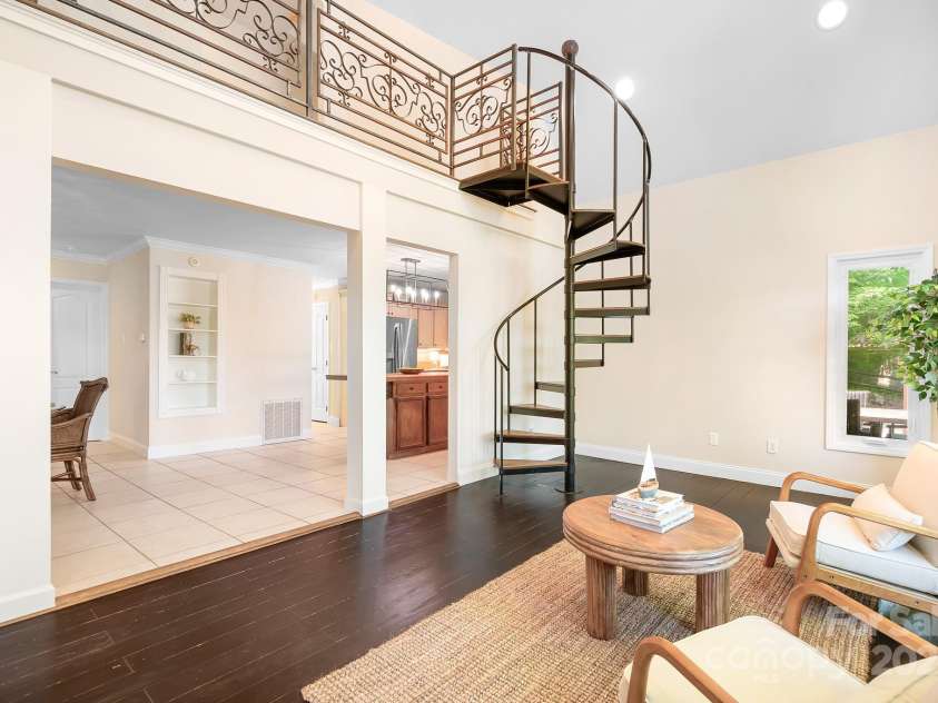 234 Winding Shore Road, Troutman, NC 28166.  MLS# CAR4245762, YatesRealty ID 10588. Decorative, metal railing adds character and charm to this upstairs balcony.