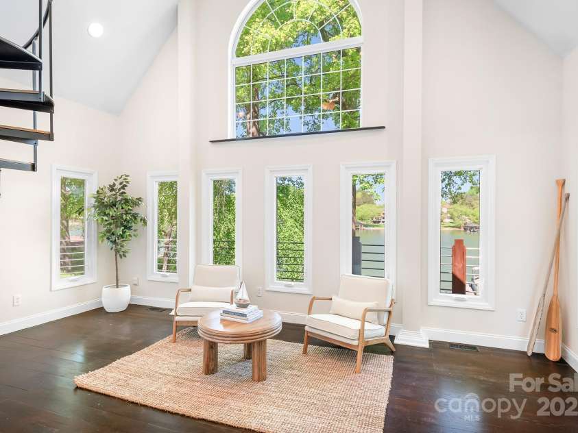 234 Winding Shore Road, Troutman, NC 28166.  MLS# CAR4245762, YatesRealty ID 10588. The charming, 2-story sunroom boasts lovely lake views.