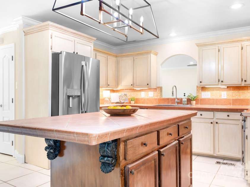 234 Winding Shore Road, Troutman, NC 28166.  MLS# CAR4245762, YatesRealty ID 10588. The kitchen is the heart of this home tying each living area together.
