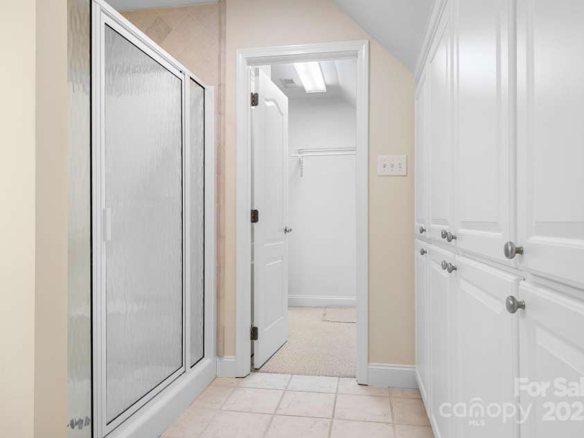234 Winding Shore Road, Troutman, NC 28166.  MLS# CAR4245762, YatesRealty ID 10588. The large bath upstairs provides useful built-in cabinet storage.