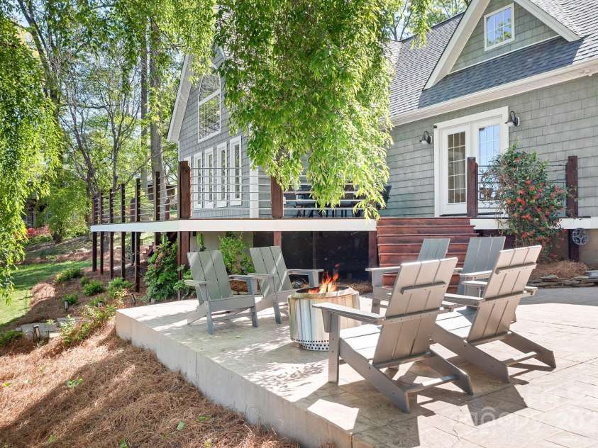 234 Winding Shore Road, Troutman, NC 28166.  MLS# CAR4245762, YatesRealty ID 10588. The stamped concrete patio is perfect for a firepit and provides additional gathering space.