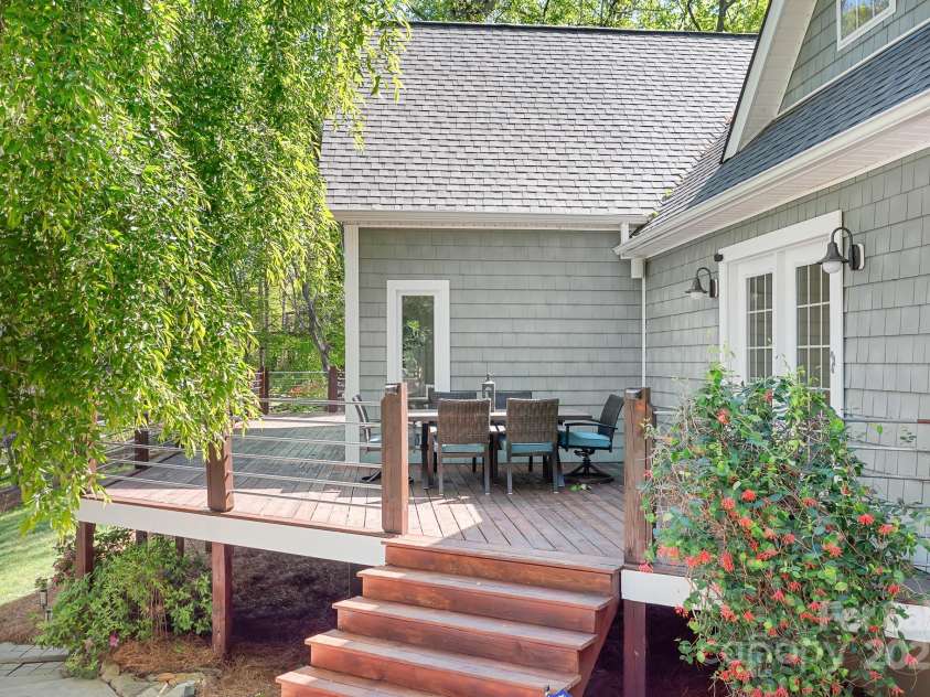 234 Winding Shore Road, Troutman, NC 28166.  MLS# CAR4245762, YatesRealty ID 10588. This side of the deck connects to the patio and driveway giving easy access to the home.