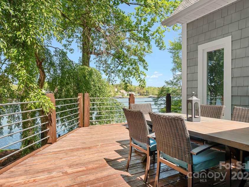 234 Winding Shore Road, Troutman, NC 28166.  MLS# CAR4245762, YatesRealty ID 10588. This side of the deck is easily accessible from the great room. Perfect for an out door meal.