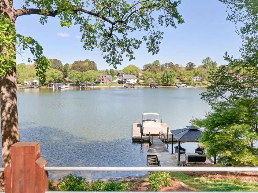 234 Winding Shore Road, Troutman, NC 28166.  MLS# CAR4245762, YatesRealty ID 10588. Views past the dock and covered sitting area.