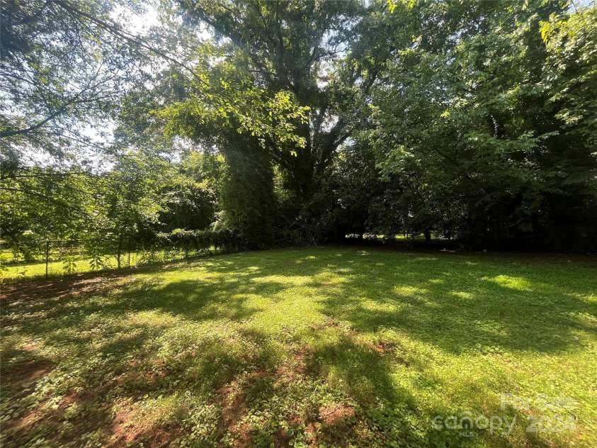 1318 Enderly Road, Charlotte, NC 28208.  MLS# CAR4143612, YatesRealty ID 106. Area in rear of home