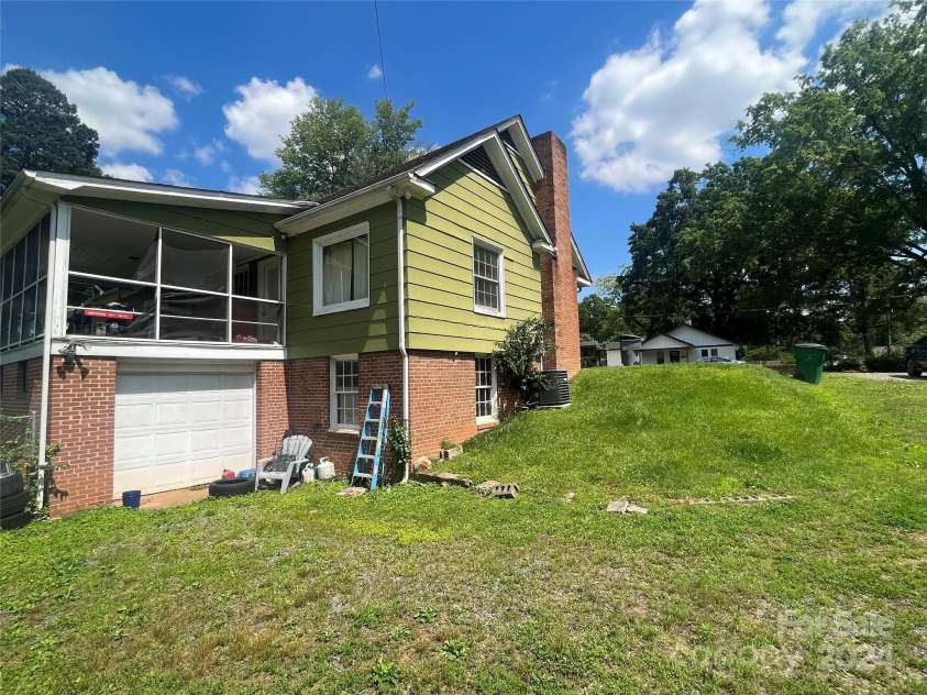 1318 Enderly Road, Charlotte, NC 28208.  MLS# CAR4143612, YatesRealty ID 106. Side view of existing home