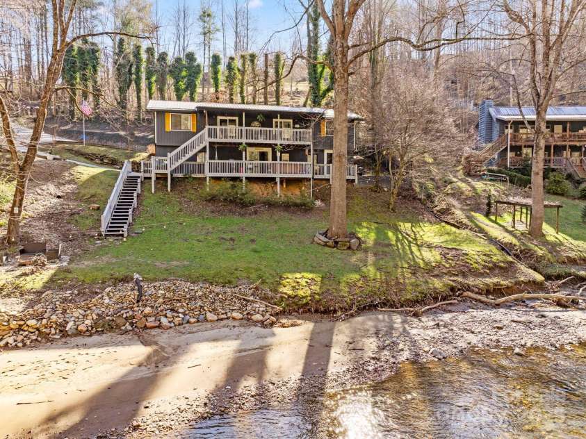 228 White Oak Road, Waynesville, NC 28785.  MLS# CAR4215162, YatesRealty ID 10603. Creekfront stunner!