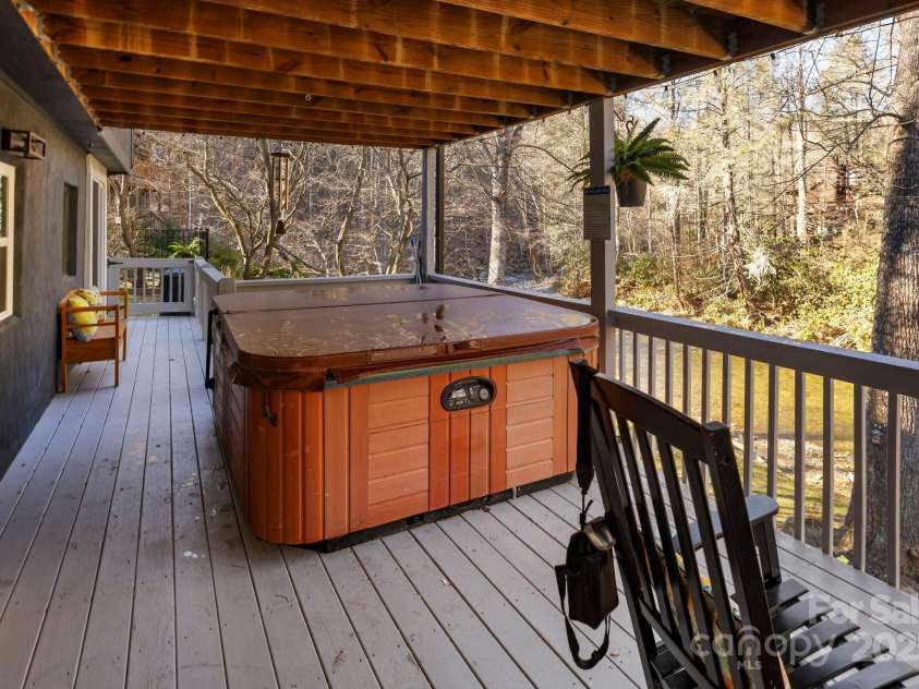 228 White Oak Road, Waynesville, NC 28785.  MLS# CAR4215162, YatesRealty ID 10603. Hot tub on lower level porch