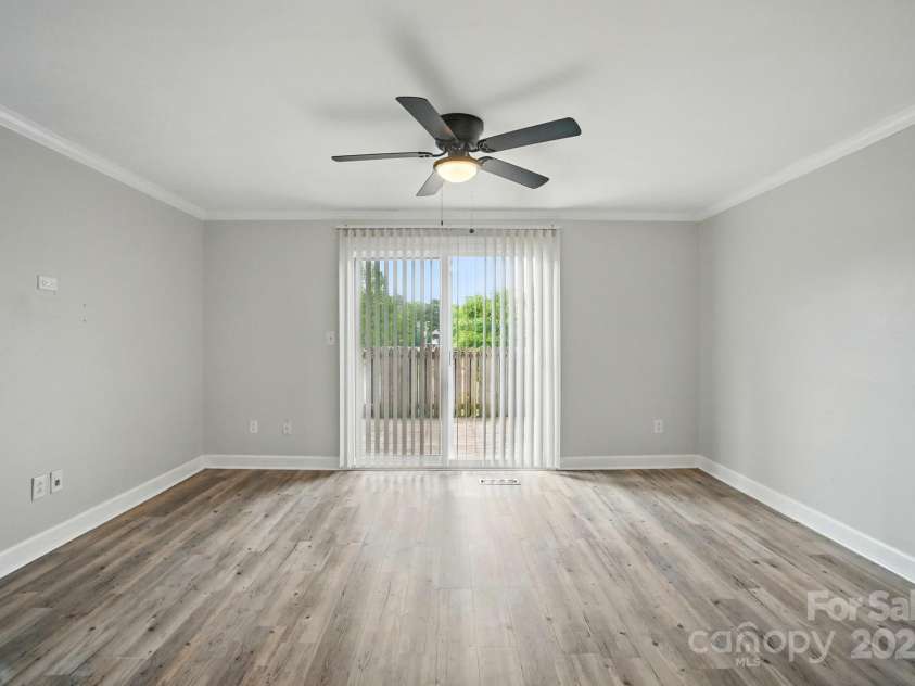 202 Water Oak Drive, Pineville, NC 28134.  MLS# CAR4250565, YatesRealty ID 10613. Living room to deck