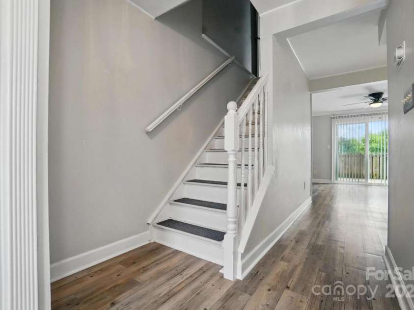 202 Water Oak Drive, Pineville, NC 28134.  MLS# CAR4250565, YatesRealty ID 10613. Stairs to upper bedrooms