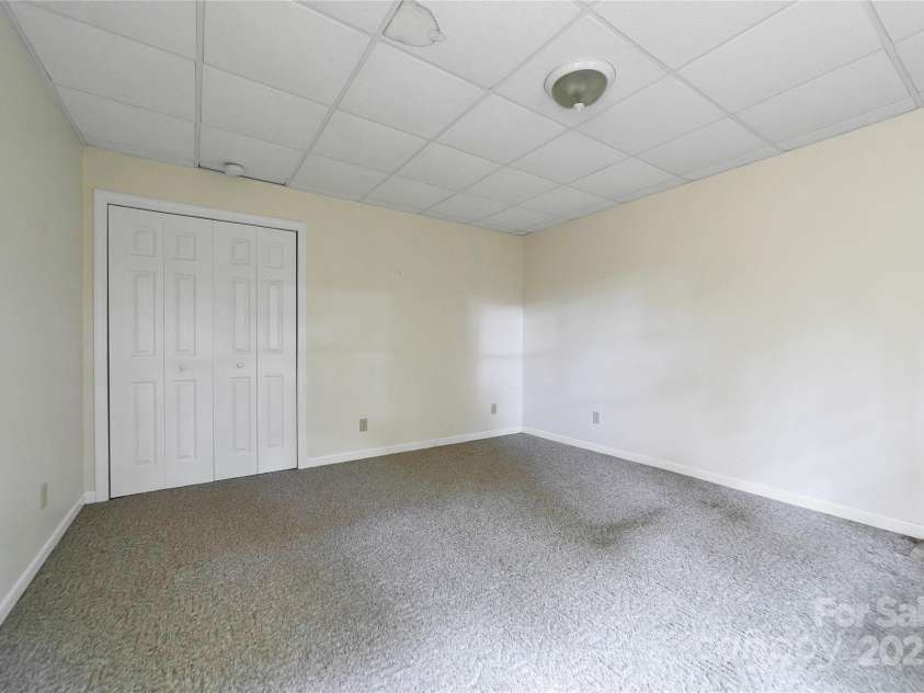 273 Inoli Circle, Brevard, NC 28712.  MLS# CAR4286189, YatesRealty ID 10618. Lower Level Bedroom