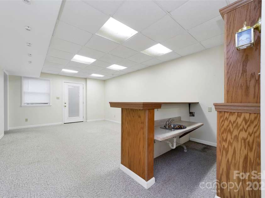 273 Inoli Circle, Brevard, NC 28712.  MLS# CAR4286189, YatesRealty ID 10618. Lower Level Family Room