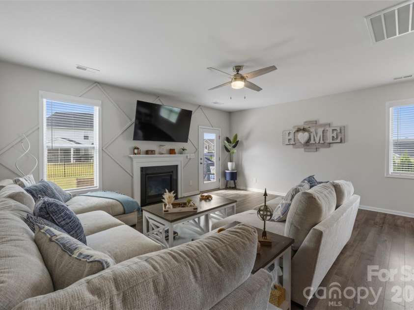 4546 Dover Court, Denver, NC 28037.  MLS# CAR4385967, YatesRealty ID 10619. Cosy livingroom with fireplace and lots of light