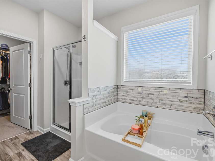 4546 Dover Court, Denver, NC 28037.  MLS# CAR4385967, YatesRealty ID 10619. Master bath on main featuring huge garden tub