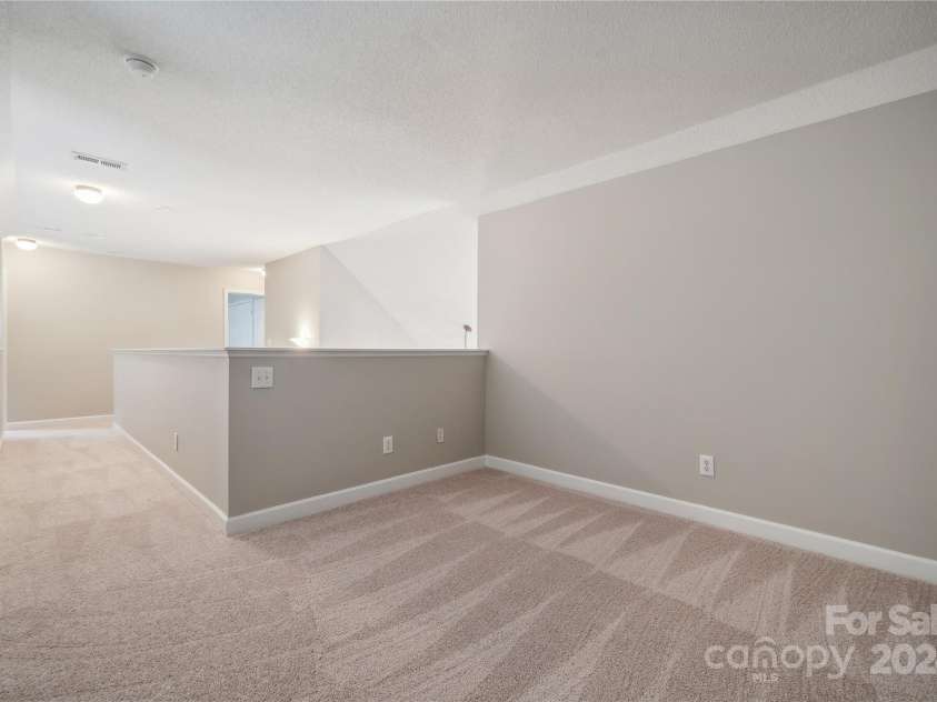 14131 Bernardy Lane, Charlotte, NC 28269.  MLS# CAR4164903, YatesRealty ID 10632. Loft space, office, game room.