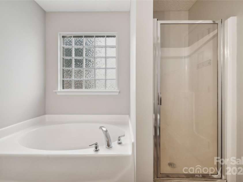 14131 Bernardy Lane, Charlotte, NC 28269.  MLS# CAR4164903, YatesRealty ID 10632. Primary bathroom