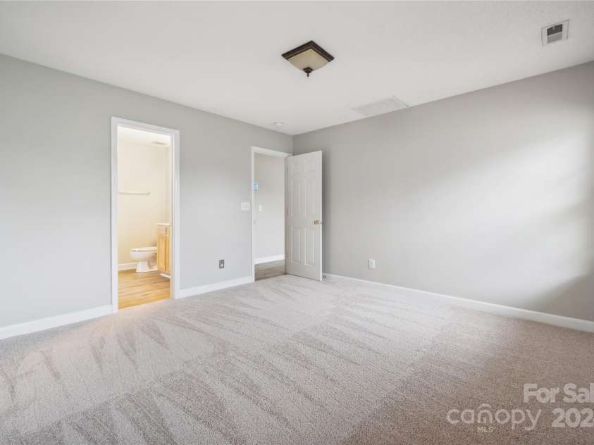 14131 Bernardy Lane, Charlotte, NC 28269.  MLS# CAR4164903, YatesRealty ID 10632. Primary bedroom