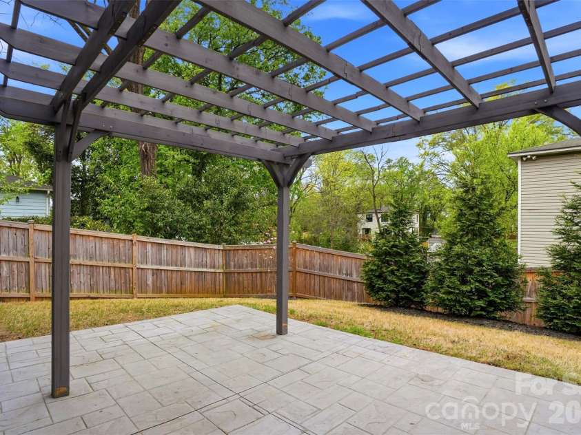 306 Lima Avenue, Charlotte, NC 28208.  MLS# CAR4363414, YatesRealty ID 10638. Cedar trees for added privacy