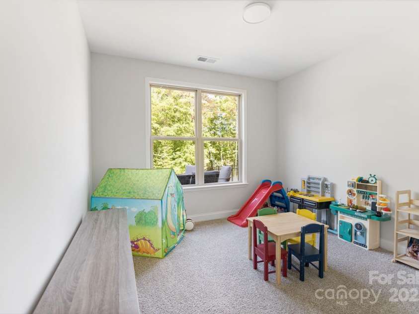 1047 Chalet Lane, Indian Land, SC 29707.  MLS# CAR4250186, YatesRealty ID 10639. Bedroom on the main floor, being used as a playroom.