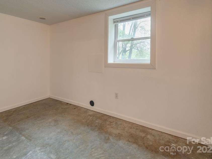 44 Arrowhead Street, Clyde, NC 28721.  MLS# CAR4251253, YatesRealty ID 10648. Fully plumbed room in basement ready to be a full bathroom