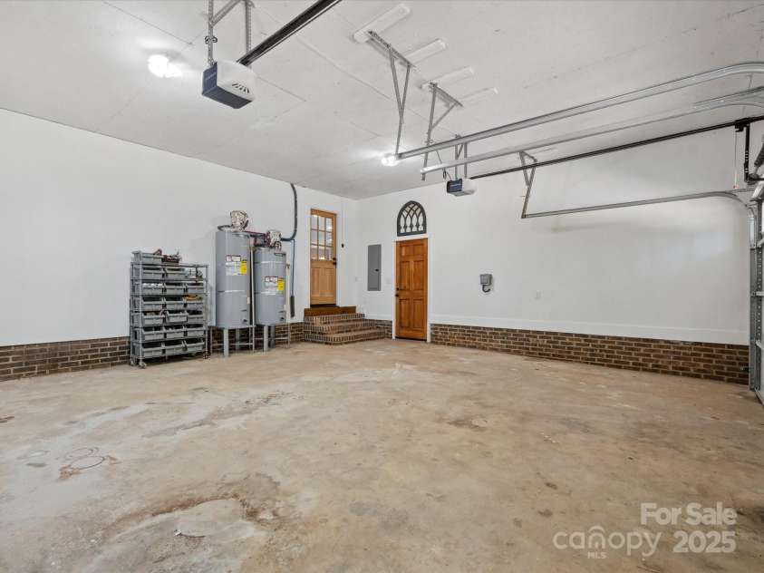 6724 Brushwood Drive, Charlotte, NC 28262.  MLS# CAR4244824, YatesRealty ID 10649. 2 Water heaters & Electric Car Charger