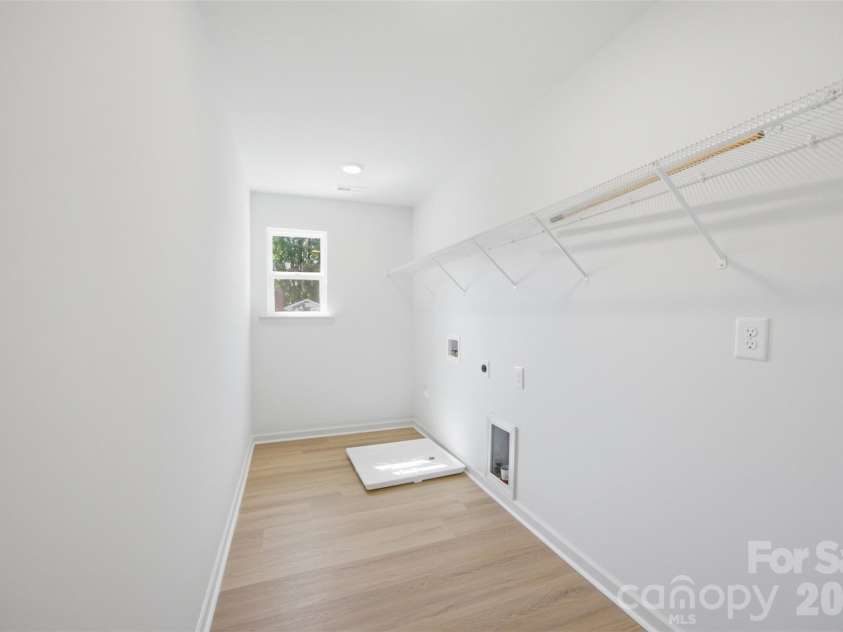 8425 Old Plank Road, Charlotte, NC 28216.  MLS# CAR4340461, YatesRealty ID 10650. Laundry Room - Upper Level