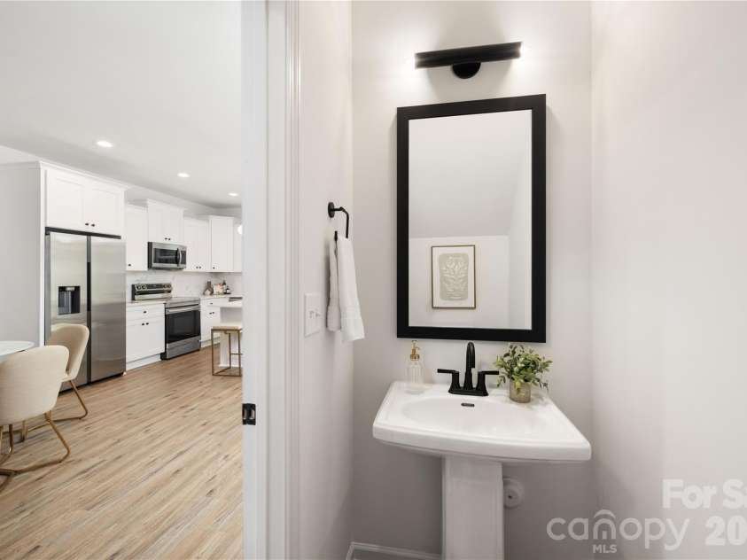 8425 Old Plank Road, Charlotte, NC 28216.  MLS# CAR4340461, YatesRealty ID 10650. Representative Photo: Main Level Half Bathroom