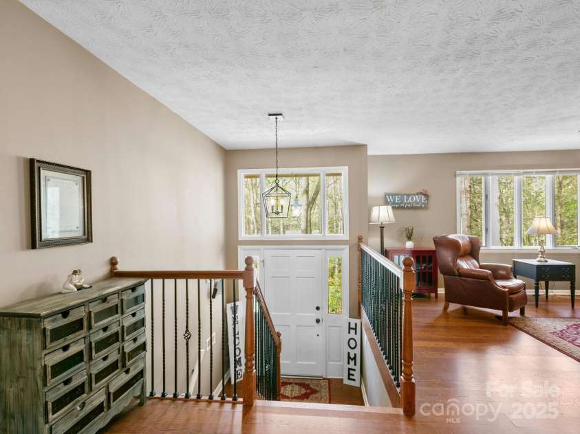 9 Cedar Trail, Asheville, NC 28803.  MLS# CAR4249342, YatesRealty ID 10651. Bright entryway with new stair railings & lighting.