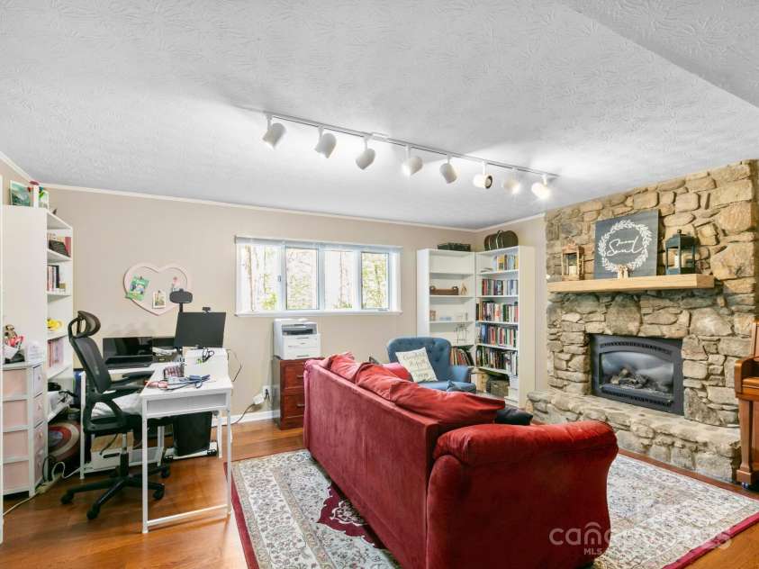 9 Cedar Trail, Asheville, NC 28803.  MLS# CAR4249342, YatesRealty ID 10651. BSMT Den with stone vented gas logs.
