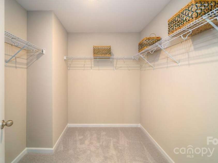 561 Fox Cove Road, Hendersonville, NC 28792.  MLS# CAR4179040, YatesRealty ID 10665. Primary bedroom walking closet.