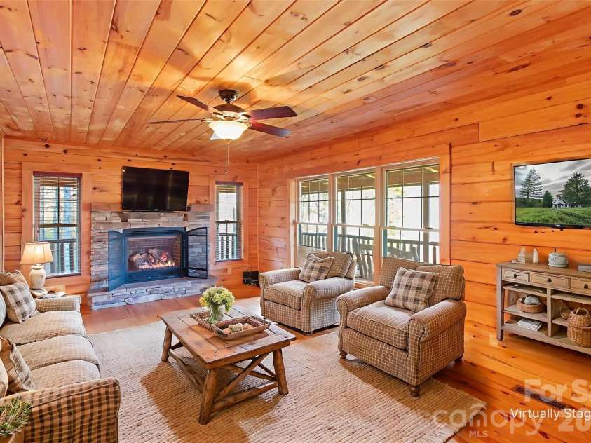 17 Aaron Way, Waynesville, NC 28786.  MLS# CAR4319469, YatesRealty ID 1067. Living  with Gas Firelogs Virtually Staged