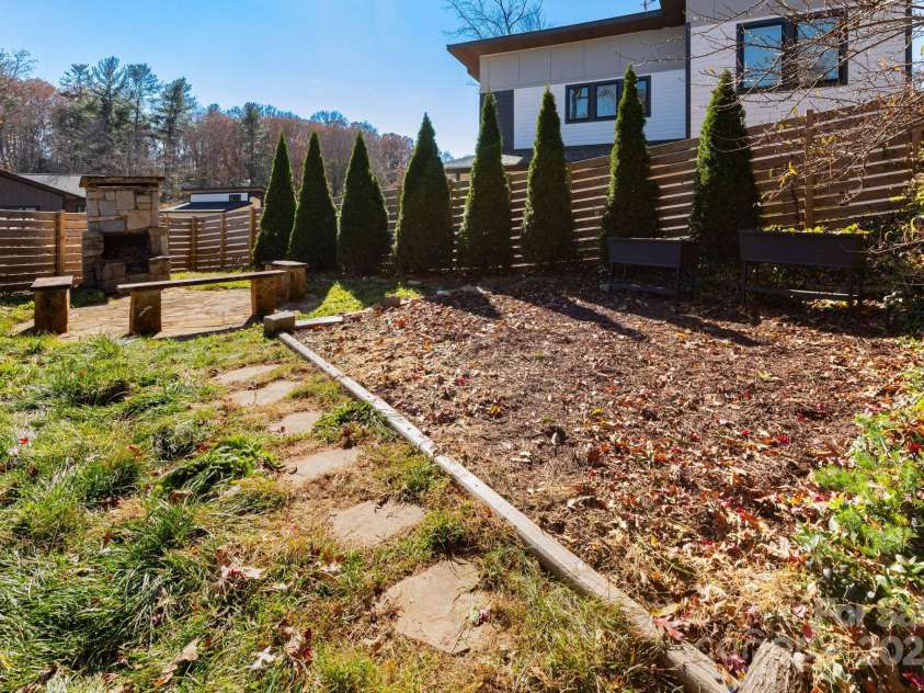 302 Iron Ridge Loop, Asheville, NC 28806.  MLS# CAR4321229, YatesRealty ID 10682. Generous backyard