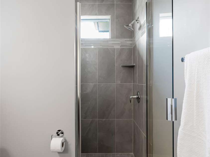 27 Mauricet Lane, Asheville, NC 28806.  MLS# CAR4242081, YatesRealty ID 10688. Walk-in tile shower.