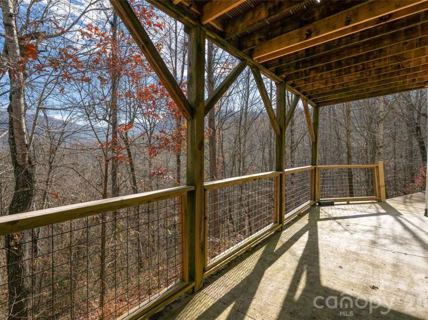 98 Sovereign Lane, Fairview, NC 28730.  MLS# CAR4326130, YatesRealty ID 10689. Basement level deck