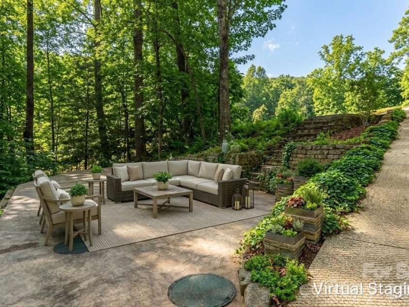 98 Sovereign Lane, Fairview, NC 28730.  MLS# CAR4326130, YatesRealty ID 10689. Expansive Patio with summer greenery