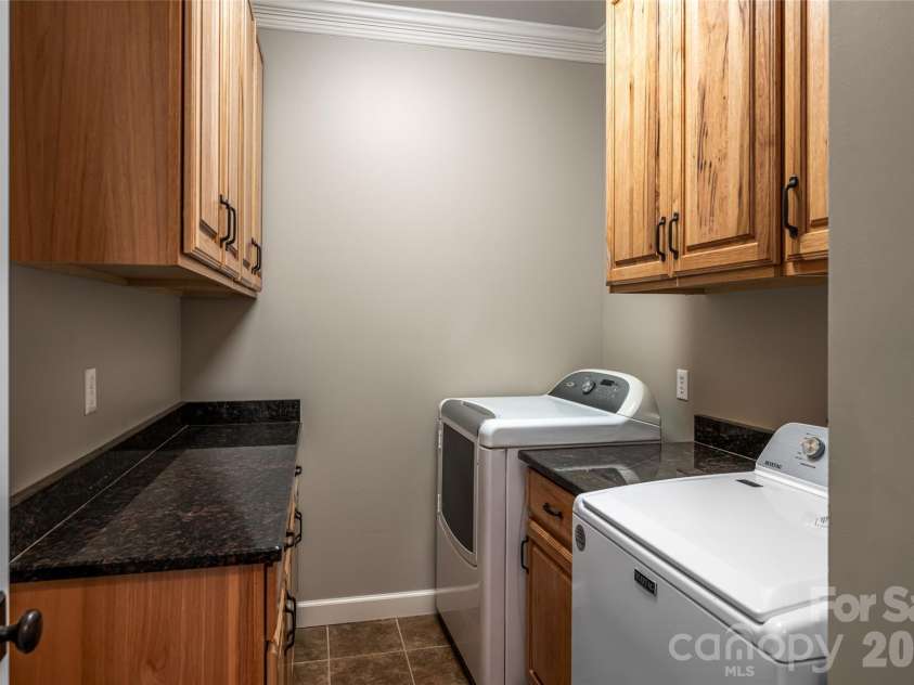 98 Sovereign Lane, Fairview, NC 28730.  MLS# CAR4326130, YatesRealty ID 10689. Main level laundry room