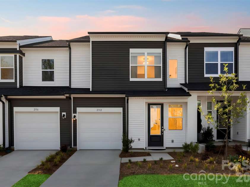 2312 Endeavor Run, Charlotte, NC 28269.  MLS# CAR4365921, YatesRealty ID 10692. Front view - sundown