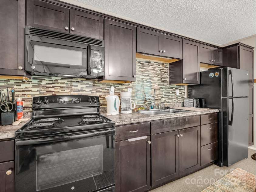 128 Winding Creek Court, Lake Lure, NC 28746.  MLS# CAR4252043, YatesRealty ID 10704. 