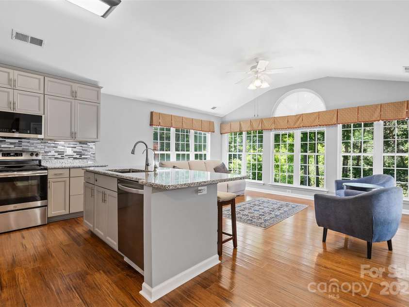 3744 Leela Palace Way, Fort Mill, SC 29708.  MLS# CAR4252438, YatesRealty ID 10708. Kitchen open to Sunroom
