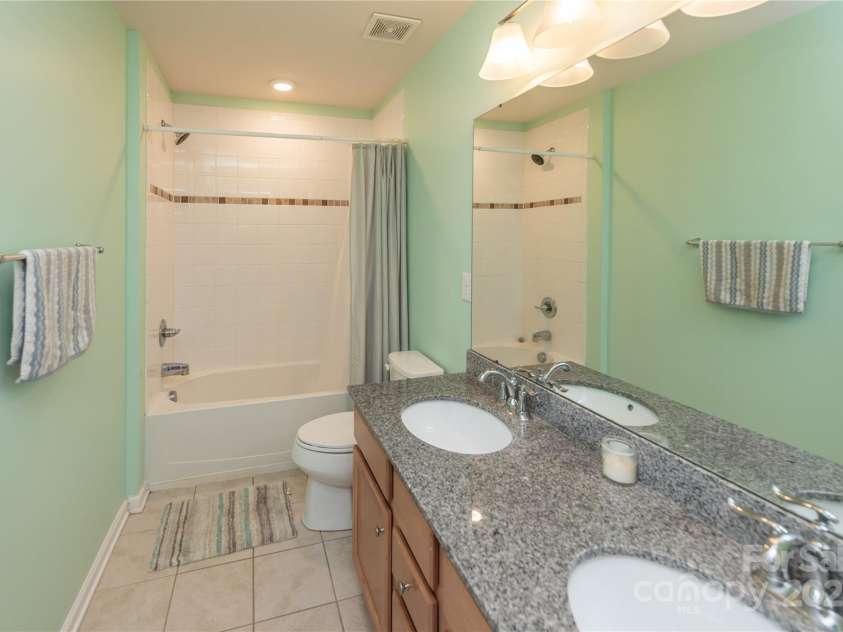 7412 Greene Mill Avenue, Concord, NC 28025.  MLS# CAR4249641, YatesRealty ID 10718. Hall bath with dual vanities