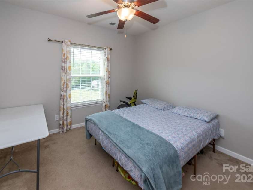 7412 Greene Mill Avenue, Concord, NC 28025.  MLS# CAR4249641, YatesRealty ID 10718. Large sized guest suite on main floor