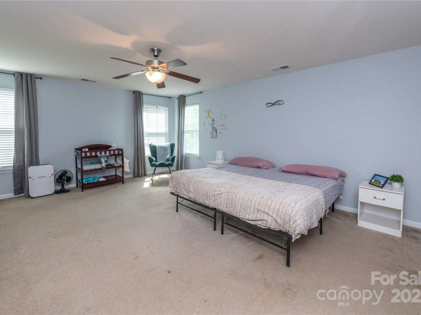 7412 Greene Mill Avenue, Concord, NC 28025.  MLS# CAR4249641, YatesRealty ID 10718. Primary bedroom with over 300 sq ft of space