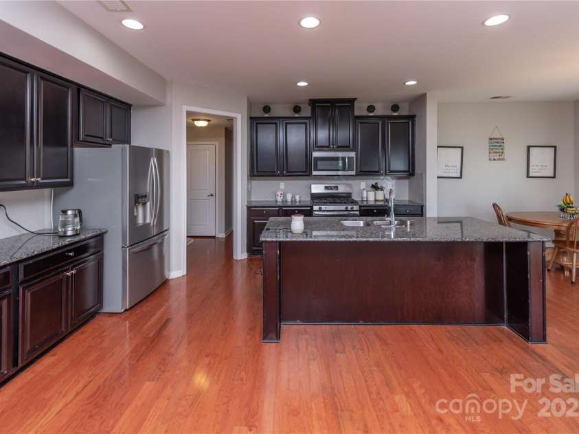 7412 Greene Mill Avenue, Concord, NC 28025.  MLS# CAR4249641, YatesRealty ID 10718. Spacious kitchen with 8' island