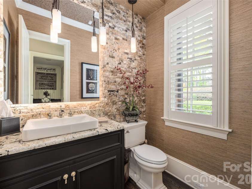 131 The Point Drive, Mooresville, NC 28117.  MLS# CAR4365432, YatesRealty ID 10720. Half bath on main with back-lit mirror