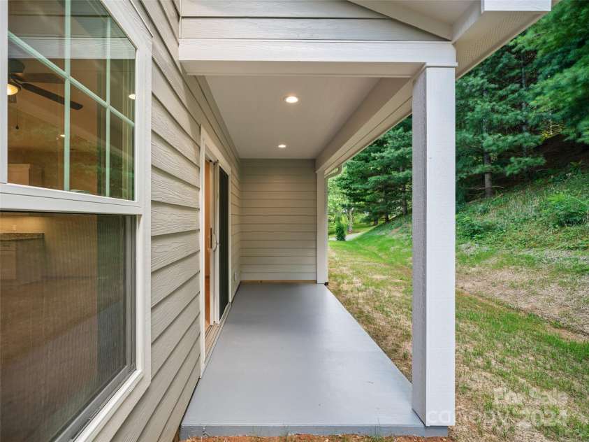 200 Red Twig Lane, Burnsville, NC 28714.  MLS# CAR4167529, YatesRealty ID 10723. Back covered porch for grilling