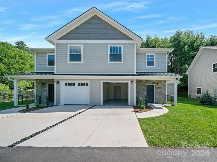 200 Red Twig Lane, Burnsville, NC 28714.  MLS# CAR4167529, YatesRealty ID 10723. Each townhome  has concrete space for additional car parking  and over flow graveled spaces off pavement for additional overflow parking