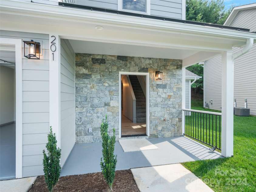 200 Red Twig Lane, Burnsville, NC 28714.  MLS# CAR4167529, YatesRealty ID 10723. Front porch covered entrance to townhome